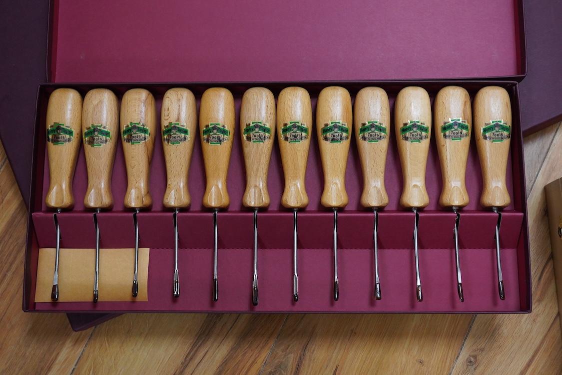 Three sets of Henry Taylor Tools Limited of Sheffield, wood carving chisels, comprising of a 12-carving chisel set contained within a fitted beech case, a set of 17 skew gouges in a fitted card case, and a set of 12 micr